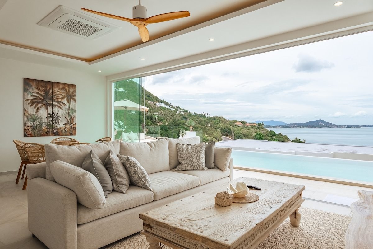 Living room at Coral Cove opening onto the sea view