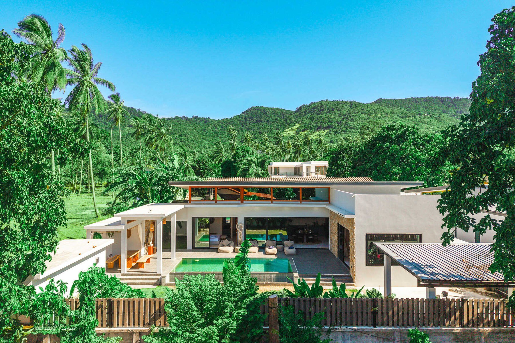 Aerial view of Pool Villa Mae Nam among the trees in Mae Nam