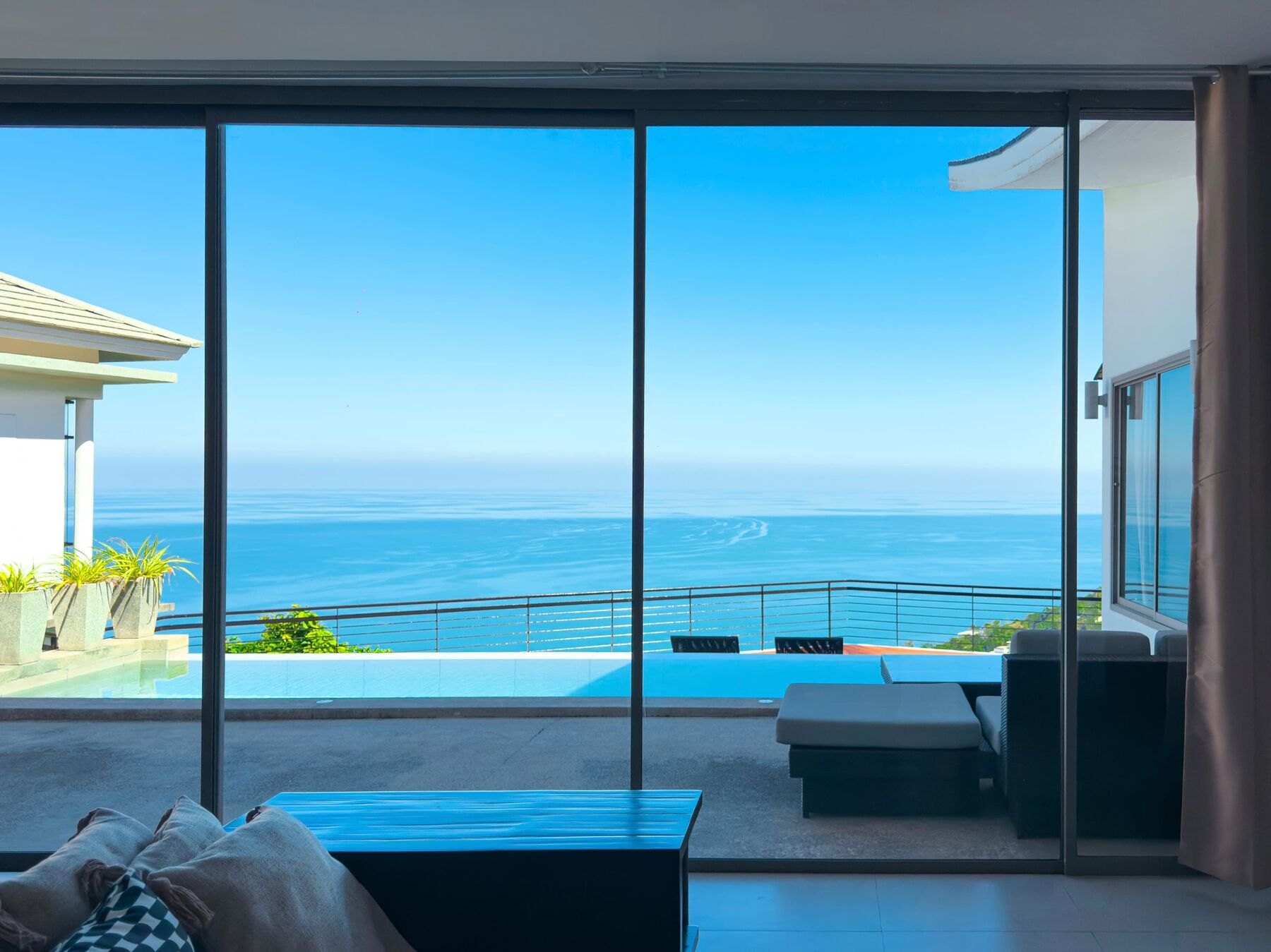 Villa Gina living room opening onto the pool and sea